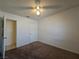 Bedroom featuring carpet floors, white walls, ceiling fan and access to another room at 256 Winona Ter, Henderson, NV 89015