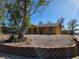Exterior view of a single-story yellow house at 256 Winona Ter, Henderson, NV 89015