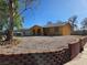 Exterior view of a single-story yellow house at 256 Winona Ter, Henderson, NV 89015