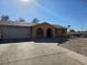 Charming single-story home featuring an arched entrance and a convenient two-car garage at 256 Winona Ter, Henderson, NV 89015
