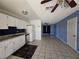 Open kitchen featuring white cabinets, a refrigerator, and an open view to the living room at 256 Winona Ter, Henderson, NV 89015