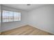 Bedroom featuring wood-style flooring and a window with light coming through at 2732 Heritage Ct, Las Vegas, NV 89121