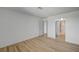 Bright bedroom featuring wood-look flooring, neutral walls, and an open closet for ample storage at 2732 Heritage Ct, Las Vegas, NV 89121