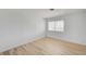 Bright bedroom with hardwood floors and a large window, offering a comfortable and serene space at 2732 Heritage Ct, Las Vegas, NV 89121