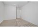 Empty bedroom featuring neutral colored walls and carpet, and a single light fixture at 2742 Zazzera Ct, Henderson, NV 89044