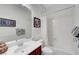 Bright bathroom featuring a shower-tub combination, framed art, and vanity with a white countertop at 2779 Kindeace Ave, Henderson, NV 89044