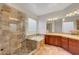 Bathroom featuring tiled shower, soaking tub, and double vanity with tiled countertops at 2779 Kindeace Ave, Henderson, NV 89044