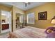 Bedroom featuring a bed, seating, carpet, and a window with plantation shutters at 2779 Kindeace Ave, Henderson, NV 89044