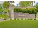 Community entrance featuring the 'Avondale' sign, lush landscaping, and a well-maintained lawn at 2779 Kindeace Ave, Henderson, NV 89044
