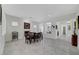 Bright open dining room with decorative fireplace and seating for six at 2779 Kindeace Ave, Henderson, NV 89044