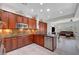 Well-appointed kitchen with stainless steel appliances, ample wood cabinet storage, and a view into the adjacent living space at 2779 Kindeace Ave, Henderson, NV 89044