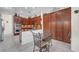 Elegant kitchen featuring custom wood cabinetry, stainless steel appliances, tiled backsplash, and a cozy dining nook at 2779 Kindeace Ave, Henderson, NV 89044