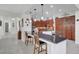 Kitchen with granite counter and dark wood cabinetry provides open concept living at 2779 Kindeace Ave, Henderson, NV 89044