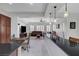 Spacious open-concept living area featuring a comfortable seating arrangement, with a view into the adjacent kitchen at 2779 Kindeace Ave, Henderson, NV 89044