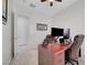 Well-lit office space with tiled floors, an executive desk, and a comfortable leather chair for work at 2779 Kindeace Ave, Henderson, NV 89044