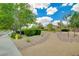 Neighborhood park with walking paths, lush landscaping, and inviting benches for leisure at 2779 Kindeace Ave, Henderson, NV 89044