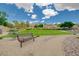 Beautiful park featuring a green lawn, walking path, seating and landscaped surroundings at 2779 Kindeace Ave, Henderson, NV 89044