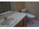 A traditionally styled bathroom featuring a ceramic sink, toilet and shower at 2851 S Valley View Blvd # 1134, Las Vegas, NV 89102