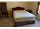 Neutral bedroom featuring red headboard, carpet, desk, and window at 2851 S Valley View Blvd # 1134, Las Vegas, NV 89102