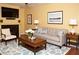 Inviting living room with a cozy fireplace, neutral-toned furniture, and a large window at 2851 S Valley View Blvd # 1134, Las Vegas, NV 89102