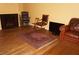 Cozy living room features a fireplace, wood floors, and comfortable seating arrangement at 2851 S Valley View Blvd # 1134, Las Vegas, NV 89102