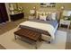 A traditionally decorated main bedroom with a large bed, bench, and nightstands at 2851 S Valley View Blvd # 1134, Las Vegas, NV 89102