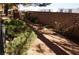 Yard with mature trees, landscaped shrubs and brick privacy fence at 2851 S Valley View Blvd # 1134, Las Vegas, NV 89102