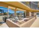 Charming balcony space with a small table and chairs, surrounded by colorful flowers and offering a serene outdoor retreat at 3111 Bel Air Dr # 201, Las Vegas, NV 89109