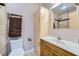 Bright bathroom features a single sink vanity and a shower with beige tiled walls at 3111 Bel Air Dr # 201, Las Vegas, NV 89109