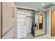 Walk-in closet with built-in shelving and a mirrored sliding door to the laundry area at 3111 Bel Air Dr # 201, Las Vegas, NV 89109