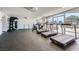Well-equipped gym featuring treadmills, weights, and floor-to-ceiling windows offering natural light and scenic views at 3111 Bel Air Dr # 201, Las Vegas, NV 89109
