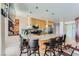 Modern kitchen features a granite countertop island with seating, stainless steel appliances, and stylish pendant lighting at 3111 Bel Air Dr # 201, Las Vegas, NV 89109