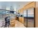 Modern kitchen with stainless steel appliances, granite countertops, and island seating at 3111 Bel Air Dr # 201, Las Vegas, NV 89109