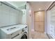 Laundry room area with a stacked washer/dryer and shelving at 3111 Bel Air Dr # 201, Las Vegas, NV 89109