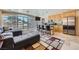 Inviting living room with kitchen island seating and large windows offering outdoor views at 3111 Bel Air Dr # 201, Las Vegas, NV 89109