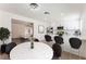 Bright dining area with modern chandelier, adjacent to the kitchen with stainless appliances at 313 Agora Way, Las Vegas, NV 89110
