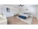 The staged primary bedroom offers a spacious layout, light hardwood floors and minimal decor at 313 Agora Way, Las Vegas, NV 89110