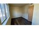 This bedroom has vinyl floors, a window, and a door to the closet at 3412 Mercury St # I, North Las Vegas, NV 89030