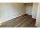 Bedroom with vinyl flooring, large closet, and electrical outlets at 3412 Mercury St # I, North Las Vegas, NV 89030