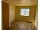 Bedroom includes new vinyl flooring and a window with natural light at 3412 Mercury St # I, North Las Vegas, NV 89030