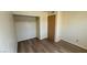 The bedroom has laminate flooring, a built-in closet, and a clean, neutral color scheme at 3412 Mercury St # I, North Las Vegas, NV 89030