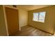 Bedroom with vinyl flooring, window and door at 3412 Mercury St # I, North Las Vegas, NV 89030