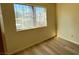 Bedroom view showing a window and plank flooring at 3412 Mercury St # I, North Las Vegas, NV 89030