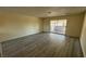 Spacious living room includes sliding door access to the outdoor covered patio at 3412 Mercury St # I, North Las Vegas, NV 89030