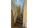 Carpeted staircase leading to entry door with sidelight, providing a warm and inviting welcome to the home at 3412 Mercury St # I, North Las Vegas, NV 89030