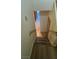 Carpeted staircase leading to tiled hallway with natural light and a neutral color palette, creating a bright and inviting space at 3412 Mercury St # I, North Las Vegas, NV 89030