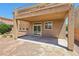 Covered patio with recessed lighting features sliding glass door access to the yard and desert landscaping at 3609 Kingfishers Catch Ave, North Las Vegas, NV 89084