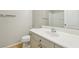 Well-lit bathroom featuring a vanity with a white sink and a shower with tub at 3609 Kingfishers Catch Ave, North Las Vegas, NV 89084