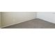 A neutral carpeted bedroom with a bi-fold closet door at 3609 Kingfishers Catch Ave, North Las Vegas, NV 89084