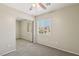 Carpeted bedroom with mirrored closet doors and a window with neighborhood view at 3609 Kingfishers Catch Ave, North Las Vegas, NV 89084
